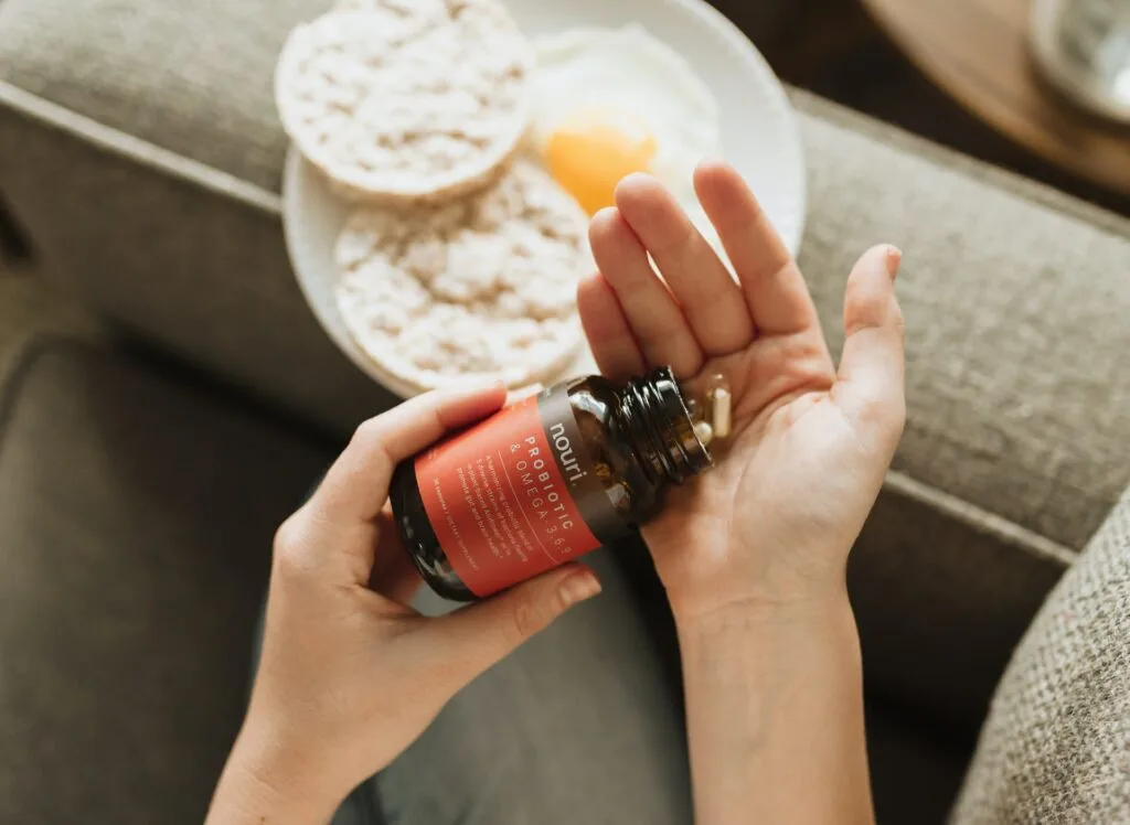Daily vitamin supplements in a glass jar